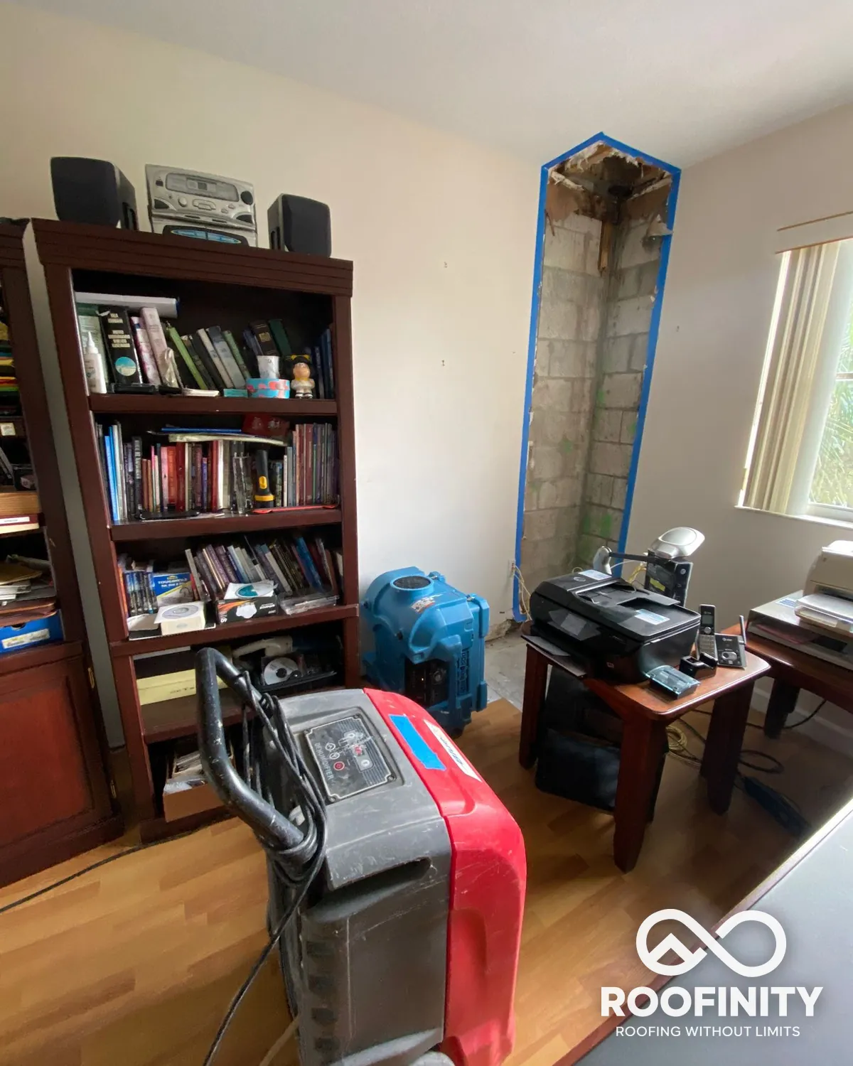 Roofinity water damage dry out with wall opened and drying equipment